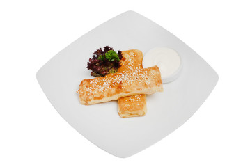 Homemade pancakes with meat on a white plate on white isolated background