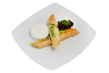 Homemade pancakes with meat on a white plate on white isolated background