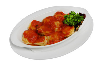 Ravioli pasta with red tomato sauce, dumplings in red sauce on a white isolated background