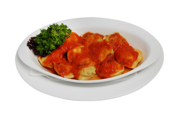 Ravioli pasta with red tomato sauce, dumplings in red sauce on a white isolated background
