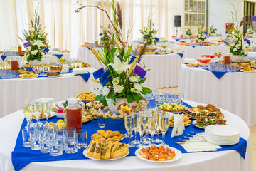 Festively laid tables at the Banquet. Various delicacies, snacks and drinks. Catering.