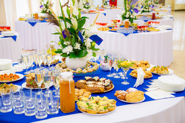 Festively laid tables at the Banquet. Various delicacies, snacks and drinks. Catering.