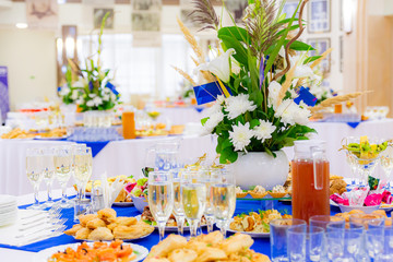 Festively laid tables at the Banquet. Various delicacies, snacks and drinks. Catering.