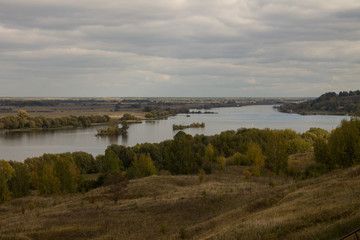 Autumn panoramic landscape with river and hills cloudy day in Konstantinovo village Russia