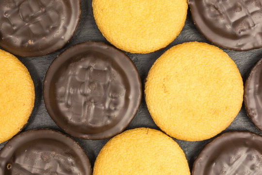 background of jaffa cakes covered with chocolate and orange jelly filling