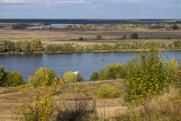 Autumn panoramic landscape with river and hills cloudy day in Konstantinovo village Russia