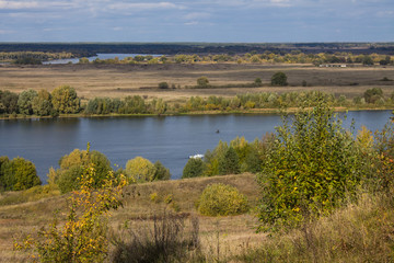 Autumn panoramic landscape with river and hills cloudy day in Konstantinovo village Russia