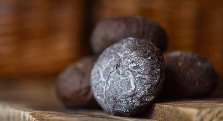 brown rye buns with cumin on a wooden table