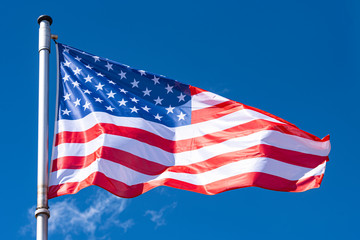 USA Flag and blue Sky as Background, American Flag waving on flagpole, New York