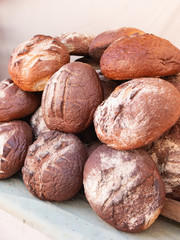 A pile of sourdough breads for sale