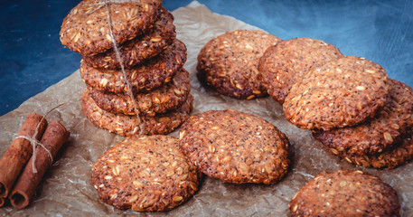 Homemade healthy oat cookies with cinnamon on brown parchment. Healthy food concept. Healthy snack