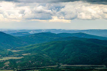 Mountains covered with forest before the rain.