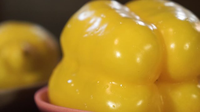 sweet yellow pepper, paprika on lemon background
