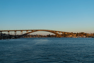 Gladesville bridge at Parramatta river view during golden light. Sydney, Australia.