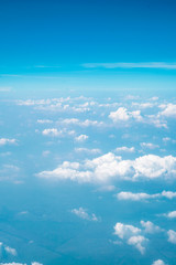 Cloudy gradient background, from cyan to blue in the sky.