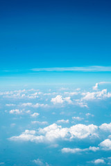 Cloudy gradient background, from cyan to blue in the sky.
