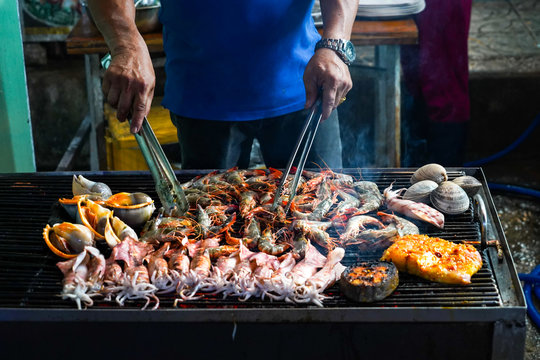 Street food in Phu Quoc island in Vietnam. Delicious seafood for tourist at market at night.