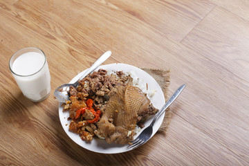 traditional indonesia food nasi gudeg with chicken Jack fruit and krecek.