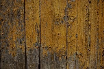 Old door with yellow painting