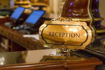 Hotel reception desk with nameplate