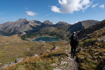 Fototapeta premium A man hiking in the mountains in the Alps in France