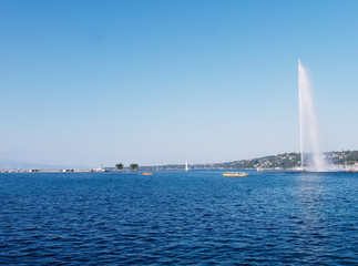 Famous Jet d'Eau fountain of the Geneva lake on a sunny day in Switzerland.