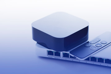 Smart home and media concept.  Cloud switch, smart media player and remote control on the white...