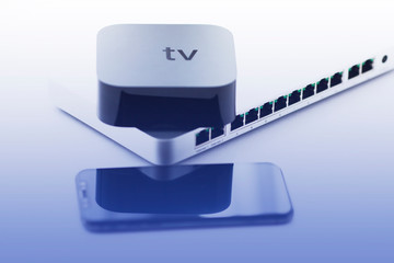Smart home and media concept.  Cloud switch, smart media player and remote control on the white...