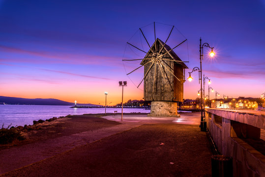 Old windmill at night ancient town of Nesebar in Bulgaria.