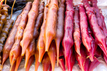 Churchkhela. Dessert sold in local food market in Georgia, Tbilisi or Batumi. Traditional Georgian homemade sweets with hazelnuts, walnuts, grape juice, honey (sugar), wheat flour (corn flour).