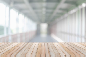 wooden table perspective counter front of blur walk way outdoor background. mock up for montage display product advertise banner.