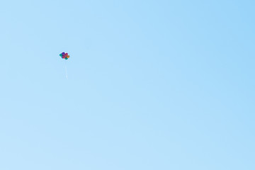 Multicolor baloons at the blue sky.