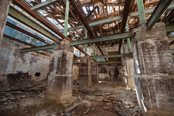 Fototapeta na wymiar Destroyed old industrial building. Ruined house.