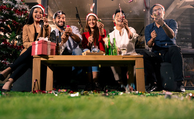 Group of friend enjoy the Christmas new year party with happiness. Friend drinking wine in the party at nightclub.