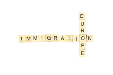 Immigration minimalistic concept. Isolated wooden letter blocks with word cloud Immigration to Europe