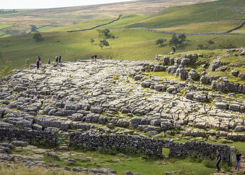 The famous limestone pavement above Malham Cove from which hikers get stunning views across the Yorkshire Dales