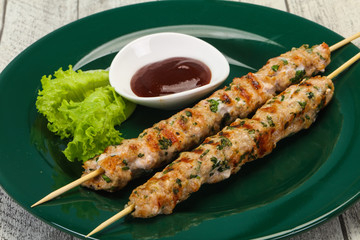 Minced pork skewer kebab with sauce