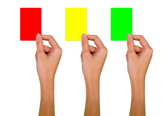 Hand holding a red card, a yellow card, a green card on a white background. with clipping path