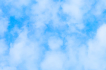 Fototapeta na wymiar blue sky background with white fluffy clouds