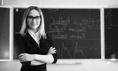 Background with math symbols and teacher in primary school
