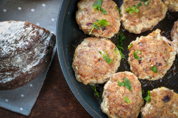 burgers in a pan and fresh bread for lunch