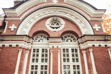 Obraz premium antique brick Church with white old Windows