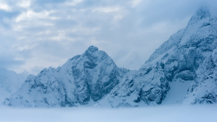 Fototapeta na wymiar beautiful deep blue panorama of winter landscape with mountains, Dombaj, Russia, copy space