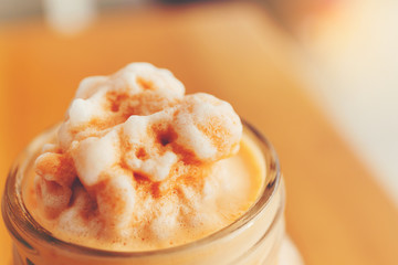Thai milk tea smoothie in giant glass.