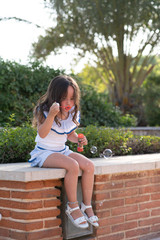 beautiful girl  Shooting Bubbles from Bubble Gun in the park
