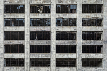 View of an old abandoned building with broken windows in Detroit Michigan