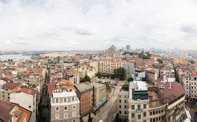 Fototapeta na wymiar Houses and public buildings densely cover an area of Istanbul, Turkey