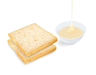 Bread with pouring condensed milk in cup on white background
