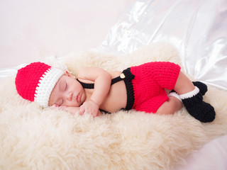 cute four-month baby  santa  with Christmas red dress