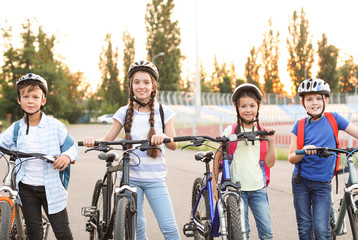 Obraz premium Cute children riding bicycles outdoors